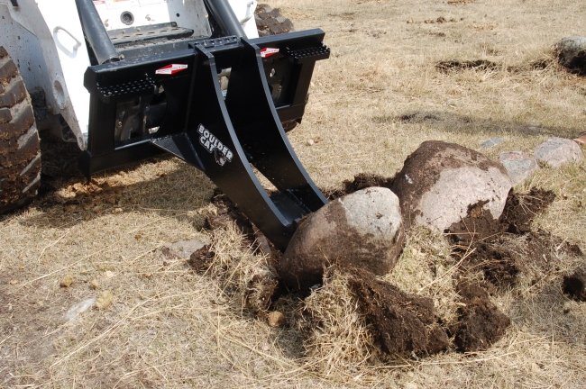 Boulder Cat digging big rocks.