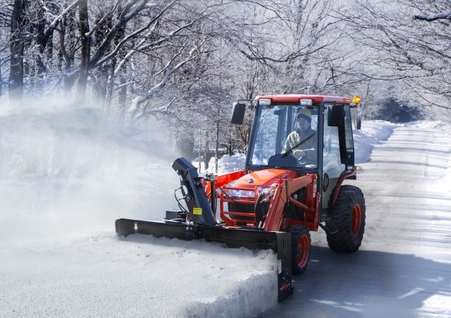 Compact Tractor Snow Blower taking a big cut.